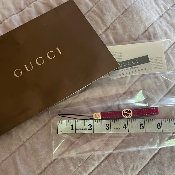 Gucci Accessories - Gucci leather berry mini cell phone strap, key fob